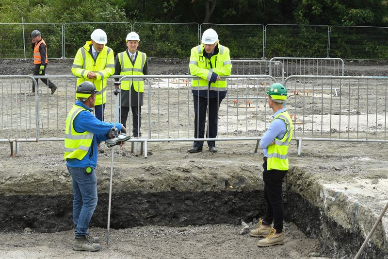 Britain's Prime Minister Boris Johnson speaks with workers as he visits the Speller Metcalfe's